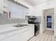 Bright kitchen with vintage-style cabinets and modern stainless steel range at 255 Lexington Dr, Daytona Beach, FL 32114
