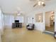 Spacious living room boasting a ceiling fan, many windows, and comfortable seating at 255 Lexington Dr, Daytona Beach, FL 32114