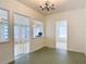 Living room with chandelier and entrances to the Sun Room and Dining Room at 255 Lexington Dr, Daytona Beach, FL 32114