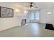 Living room with fireplace, ceiling fan, and white sheer window treatments at 255 Lexington Dr, Daytona Beach, FL 32114