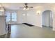 Bright living room with fireplace, vintage lighting, and archway details at 255 Lexington Dr, Daytona Beach, FL 32114