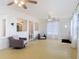 An airy living room featuring seating, large windows, and a ceiling fan at 255 Lexington Dr, Daytona Beach, FL 32114
