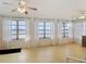 Spacious sun room with ceiling fans and large windows providing waterfront views at 255 Lexington Dr, Daytona Beach, FL 32114