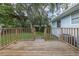 Backyard includes a wood fence and deck at 2617 Pine Tree Dr, Edgewater, FL 32141
