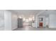 Modern kitchen featuring stainless steel appliances, white cabinetry, and ample counter space at 2617 Pine Tree Dr, Edgewater, FL 32141