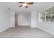 Open-concept living room with stylish flooring, modern trim, and ample natural light at 2617 Pine Tree Dr, Edgewater, FL 32141