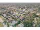 A neighborhood aerial view displays varied homes, lush trees, and the community's inviting layout at 2715 Pine Tree Dr, Edgewater, FL 32141