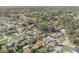 An overhead view presents a neighborhood with attractive homes, shaded by mature trees at 2715 Pine Tree Dr, Edgewater, FL 32141