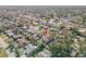 An aerial view showcases the neighborhood, highlighting well-maintained homes and greenery at 2715 Pine Tree Dr, Edgewater, FL 32141