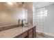 Bathroom featuring a clear bowl sink on the vanity and glass block shower at 2715 Pine Tree Dr, Edgewater, FL 32141