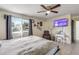 Comfortable bedroom featuring neutral walls, tile flooring, and a ceiling fan with a light fixture at 2715 Pine Tree Dr, Edgewater, FL 32141