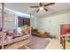 Playful bedroom with pastel walls, carpeted floors, and themed beds at 2715 Pine Tree Dr, Edgewater, FL 32141