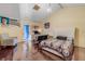 Large bedroom with hardwood floors features a bed, a television, and an armchair at 2715 Pine Tree Dr, Edgewater, FL 32141