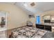 Spacious bedroom with a charming quilt, vaulted ceiling, and a decorative chandelier for a relaxing ambiance at 2715 Pine Tree Dr, Edgewater, FL 32141