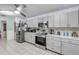 Well-lit kitchen with stainless steel appliances and ample counter space at 2715 Pine Tree Dr, Edgewater, FL 32141