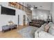 Open floor plan features living room with vaulted ceilings and stairs to the loft at 2715 Pine Tree Dr, Edgewater, FL 32141