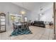Bright and airy living and dining area with tile floors and a chandelier at 2715 Pine Tree Dr, Edgewater, FL 32141