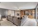 Cozy living room features a stone fireplace and large sectional sofa at 2715 Pine Tree Dr, Edgewater, FL 32141