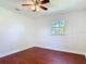 Bright bedroom features beautiful wood-look floors and a window for natural light at 3045 Pine Tree Dr, Edgewater, FL 32141