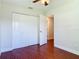 Bright bedroom features beautiful wood-look floors and double door closet at 3045 Pine Tree Dr, Edgewater, FL 32141