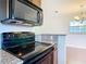 Close up of updated kitchen with modern appliances and granite countertops, offering both style and functionality at 3045 Pine Tree Dr, Edgewater, FL 32141