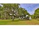 Charming single-story home on a spacious lot with mature trees and a lush green lawn at 314 Carol Ann Dr, Edgewater, FL 32132