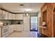 Bright kitchen with white cabinets, appliances, and ample countertop space for meal preparation at 314 Carol Ann Dr, Edgewater, FL 32132