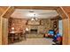 Rustic living room featuring a stone fireplace, wood accents, and a cozy dining area at 314 Carol Ann Dr, Edgewater, FL 32132