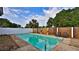 Inviting private pool area with a well-maintained pool, privacy fence, and comfortable seating at 314 Carol Ann Dr, Edgewater, FL 32132