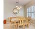 Elegant dining room with shuttered windows and a modern light fixture at 3288 Spruce Creek Gln, Port Orange, FL 32128