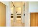 Hallway view of bathroom featuring walk in shower and soaking tub at 3288 Spruce Creek Gln, Port Orange, FL 32128