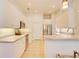 Bright kitchen features white cabinetry, stainless steel appliances, tile floor, and recessed lighting at 3288 Spruce Creek Gln, Port Orange, FL 32128