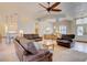 Spacious living room with tile floors, ceiling fan and comfortable seating at 3288 Spruce Creek Gln, Port Orange, FL 32128
