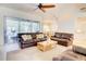 Cozy living room with comfortable couches, tile flooring and an open layout at 3288 Spruce Creek Gln, Port Orange, FL 32128