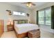 Main bedroom with a king bed, natural light, and neutral decor at 3288 Spruce Creek Gln, Port Orange, FL 32128