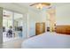 Spacious main bedroom with a sliding door to a screened lanai, plus en suite at 3288 Spruce Creek Gln, Port Orange, FL 32128