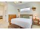 Main bedroom with a king bed, natural light, and neutral decor, plus en suite at 3288 Spruce Creek Gln, Port Orange, FL 32128
