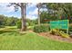 Scenic view of Overlook Park with a pond, lush green grass, and mature trees, ideal for recreation at 3288 Spruce Creek Gln, Port Orange, FL 32128