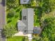 An aerial view shows the home, a new roof with skylights, landscaping, and outdoor living space at 343 Sweet Bay Ave, New Smyrna Beach, FL 32168