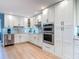 Bright kitchen featuring modern stainless appliances, custom cabinets, and sleek granite countertops at 343 Sweet Bay Ave, New Smyrna Beach, FL 32168