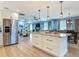 Spacious open-concept layout showcasing the kitchen, dining, and living areas in a bright and airy design at 343 Sweet Bay Ave, New Smyrna Beach, FL 32168