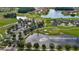 The community's aerial showcasing a lake and golf course near the community clubhouse at 349 Caryota Ct, New Smyrna Beach, FL 32168