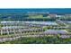 Picturesque aerial view showcasing a community nestled around a serene lake, The Club at Venetian Bay at 349 Caryota Ct, New Smyrna Beach, FL 32168