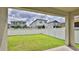 A spacious backyard featuring a well-maintained lawn and a white fence, perfect for outdoor activities and privacy at 349 Caryota Ct, New Smyrna Beach, FL 32168