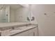Elegant bathroom with double sinks, granite countertops, and a large mirror, providing a luxurious feel at 349 Caryota Ct, New Smyrna Beach, FL 32168