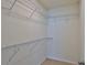 Walk-in closet with multiple wire shelving units, providing ample storage space for organization at 349 Caryota Ct, New Smyrna Beach, FL 32168