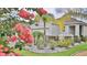 Charming single-Gathering home featuring a well-manicured lawn and beautiful landscaping around the property at 349 Caryota Ct, New Smyrna Beach, FL 32168