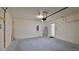 Clean and spacious garage featuring a water heater and side door at 349 Caryota Ct, New Smyrna Beach, FL 32168