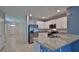 Open kitchen with granite counters, stainless steel appliances, and a functional layout for modern living at 349 Caryota Ct, New Smyrna Beach, FL 32168