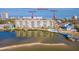 An aerial view of the large building near the water and the beach access at 3606 S Peninsula Dr # 406, Port Orange, FL 32127